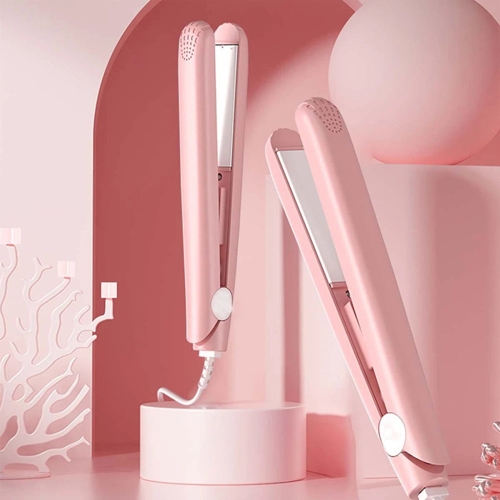 Pink hair straightener on a pink background