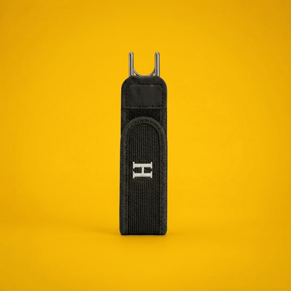 Two black straps with metal hooks on a yellow background