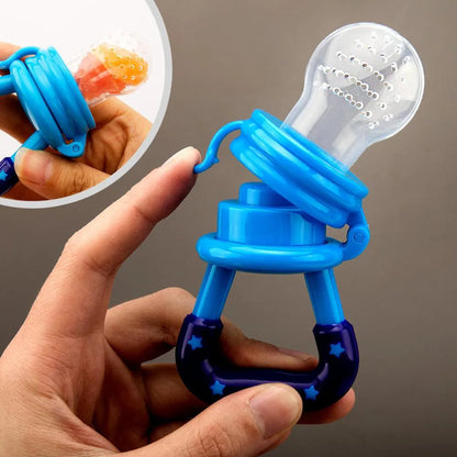 Blue pacifier with a transparent silicone sleeve held by a hand against a gray background.