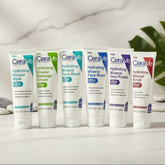 Set of CeraVe skincare products on a marble surface with a plant in the background