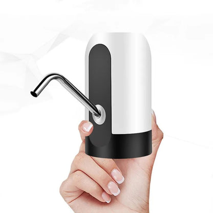 Hand holding a black and white soap dispenser against a white background